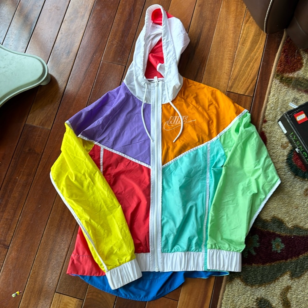 Really cool wind light weight zip up colored Nike jacket with hood.